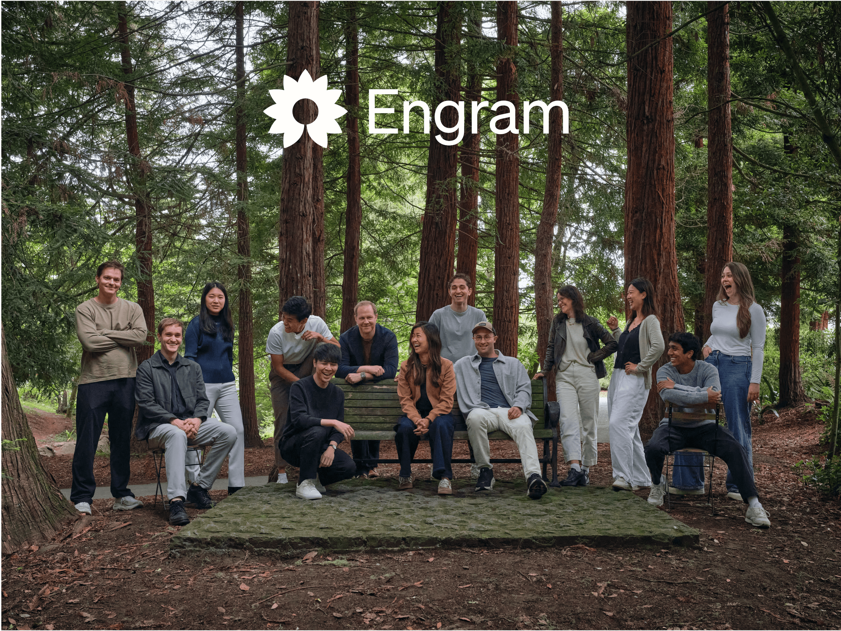 The Engram team beneath the Engram wordmark in a redwood grove